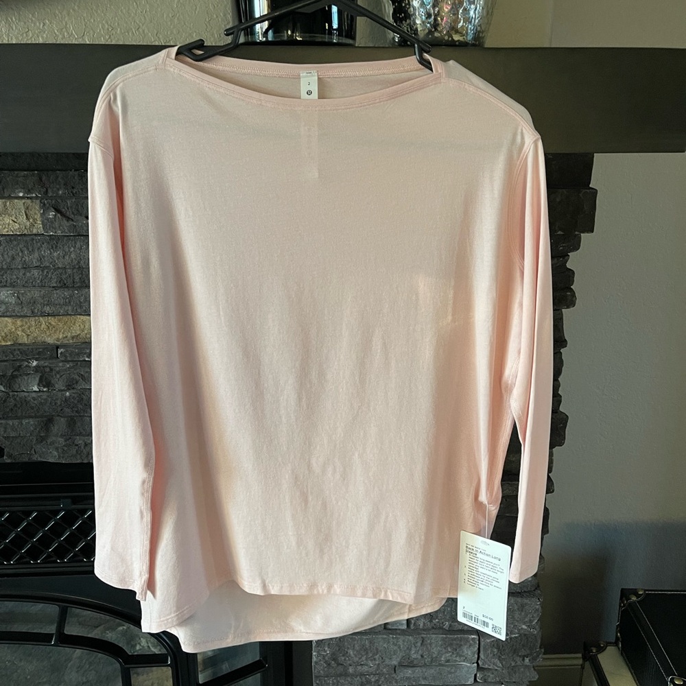 Womens Lululemon long sleeve pink top size 2 - runs large. BNWT retail $58